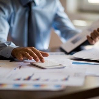 business man with calculator, and tablet