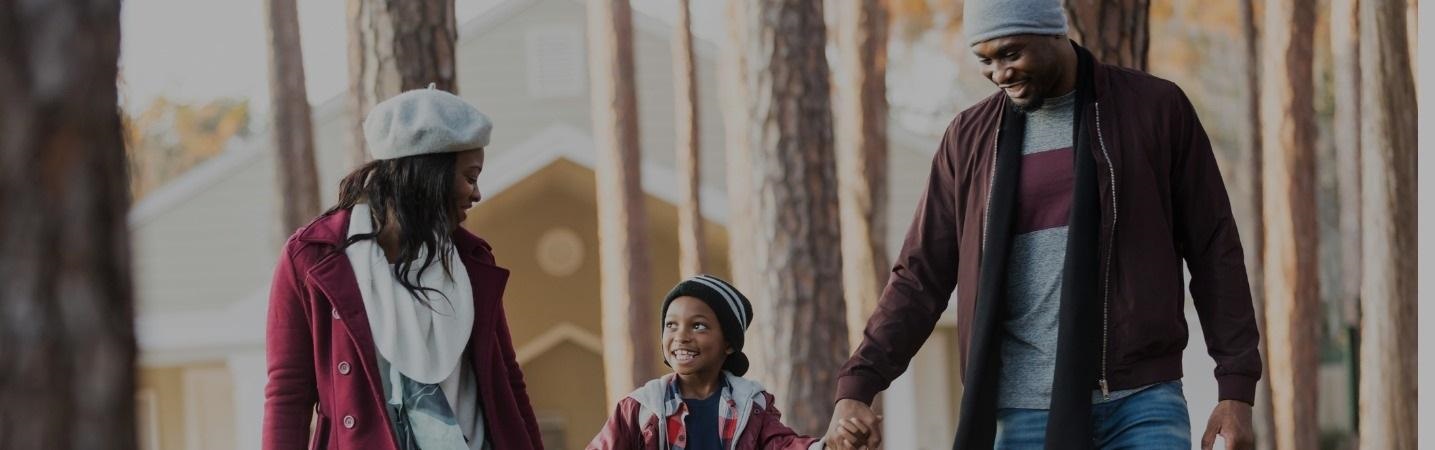African American family with boy outdoors in the park