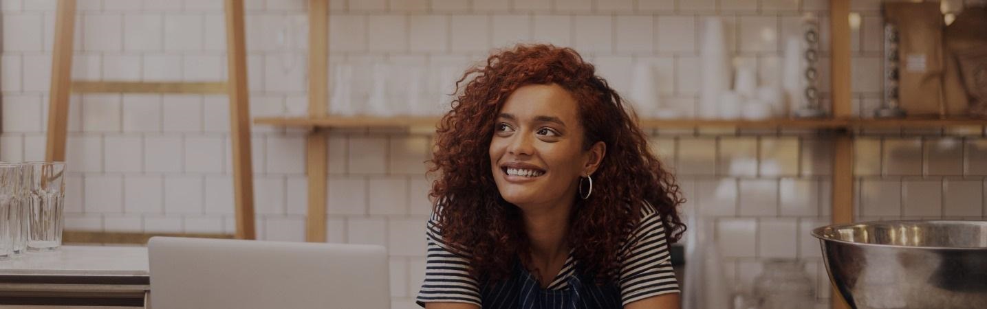 Smiling young female business owner