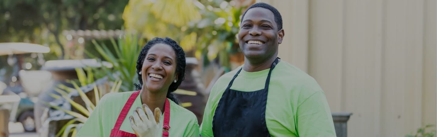 African American couple working in plant nursery