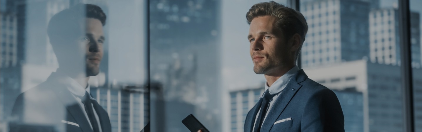 businessman looking out at the cityscape