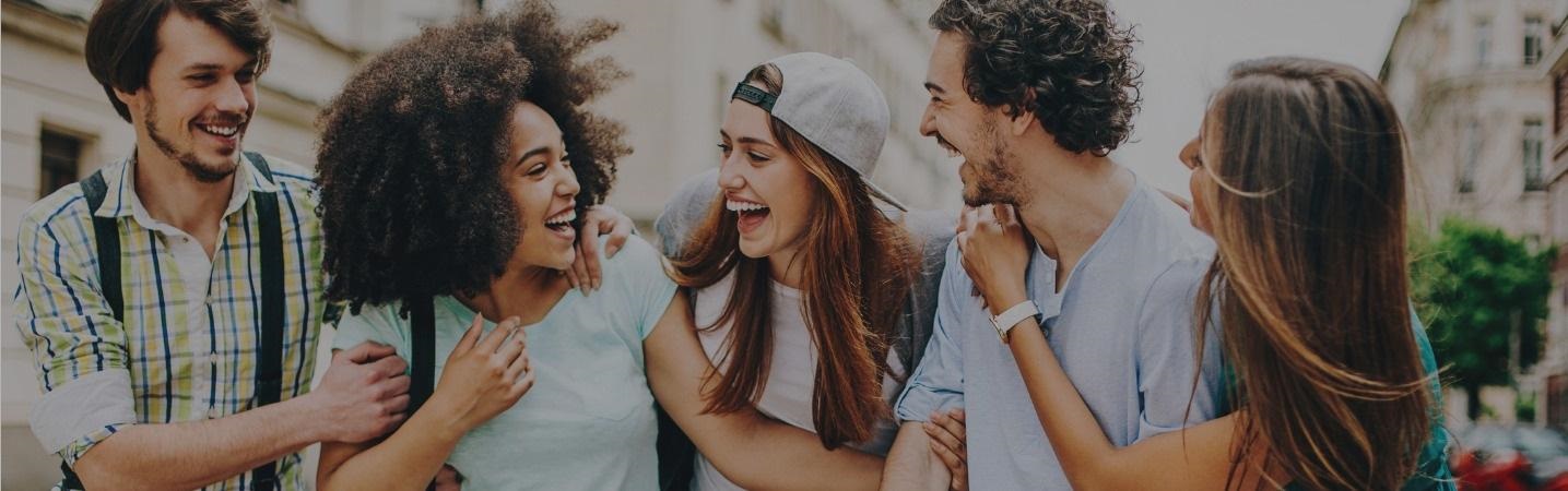 Group of mixed race friends having fun outdoors