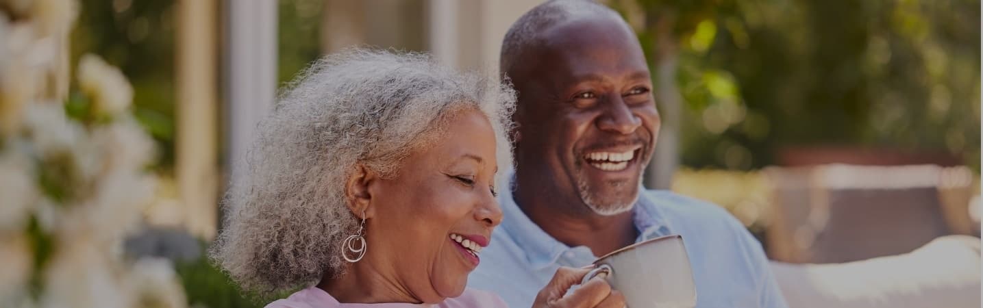 Happy senior couple enjoying a cup of coffee