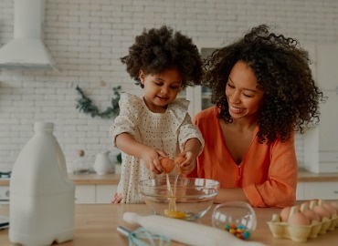 mom and daughter baking in the kitchen