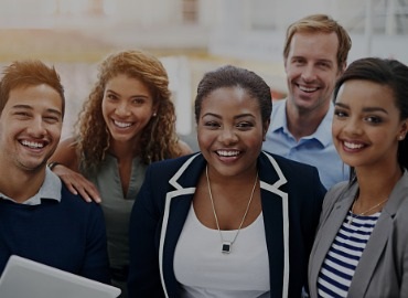 Group of diverse young professionals smiling for the camera