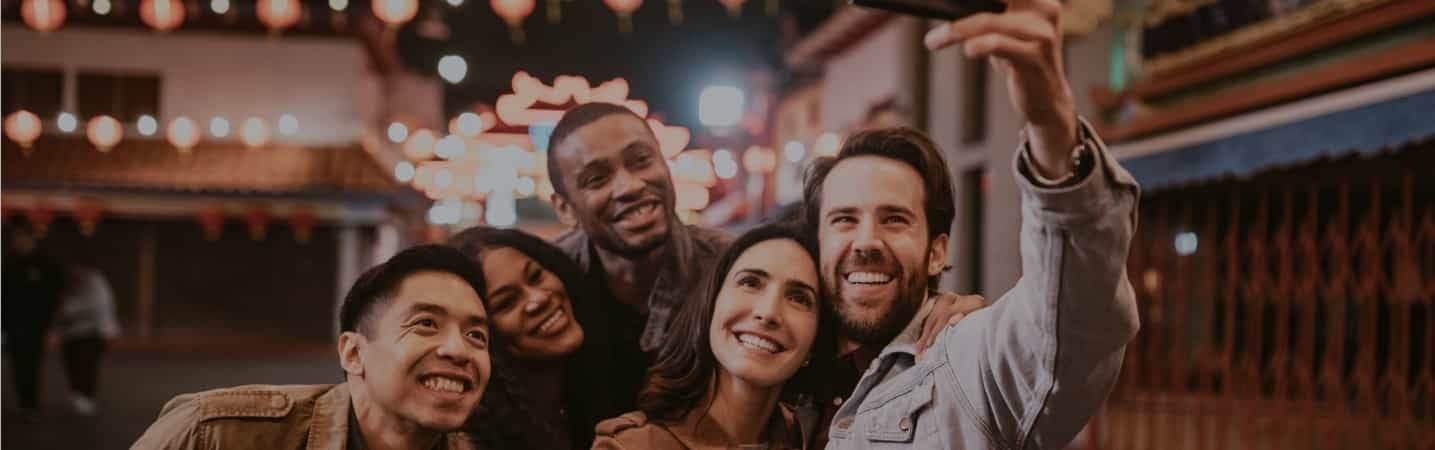 Group of friends taking a selfie downtown