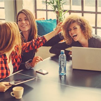 Three young women at the office