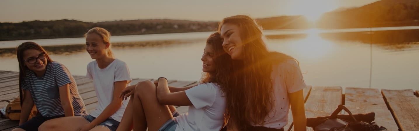 Group of girl friends at the lake