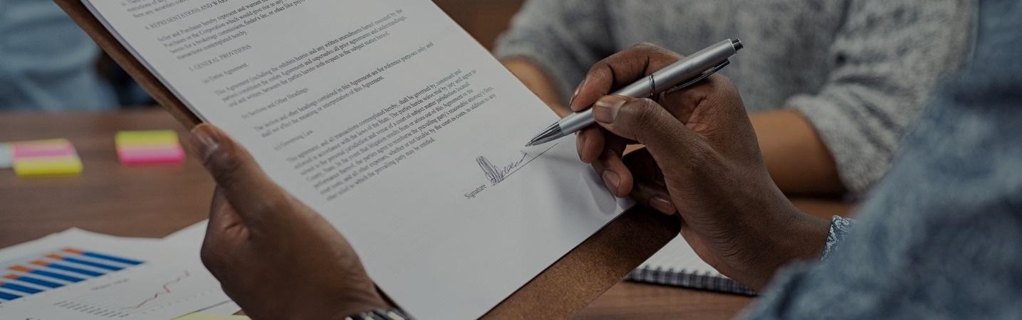 African American man signing document