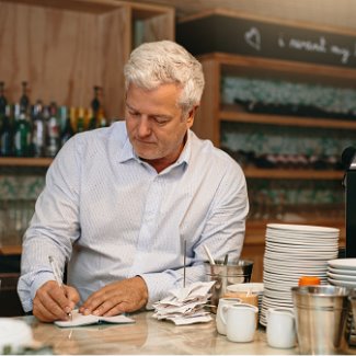 Business man writing down orders