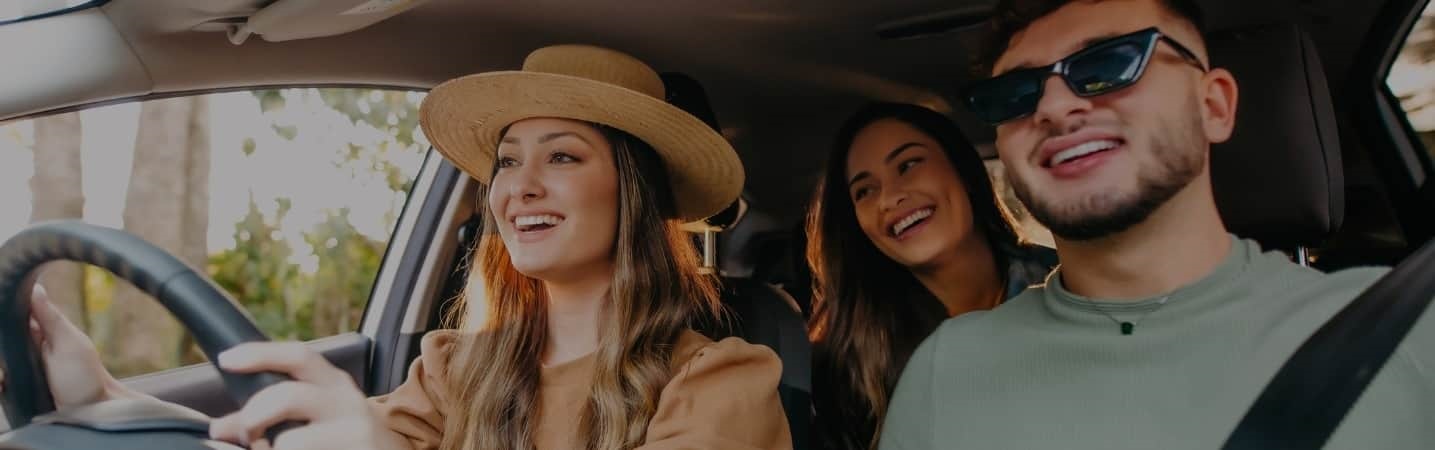 three friends in a car