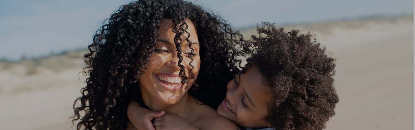 mother and daughter spending time on the beach