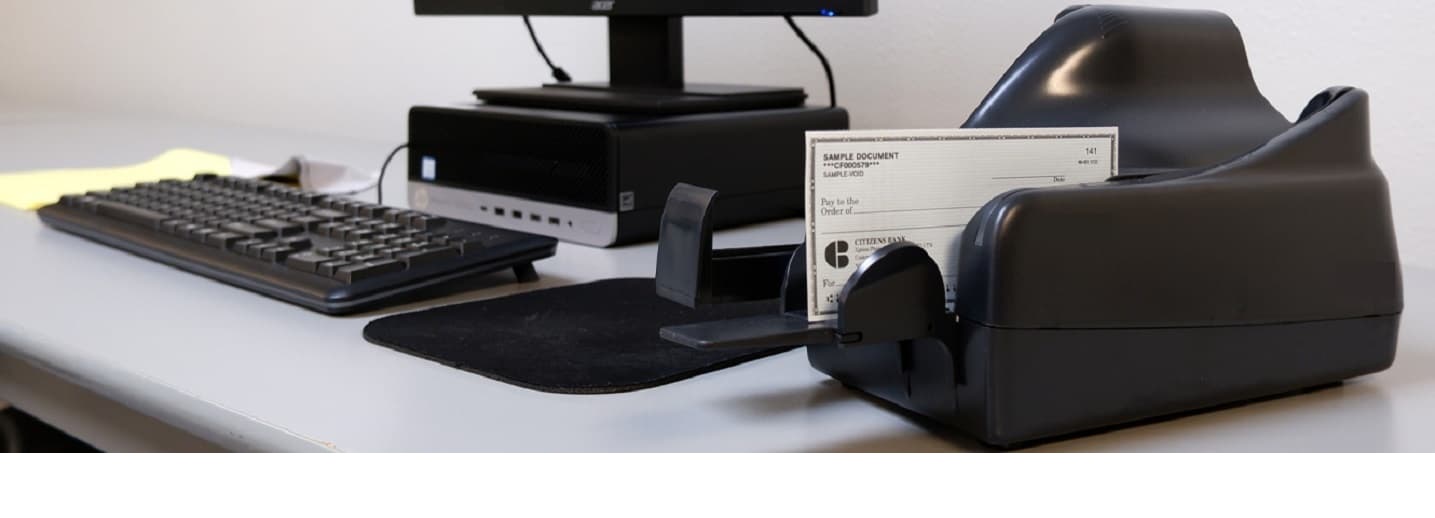 Image of a check scanner for merchant capture