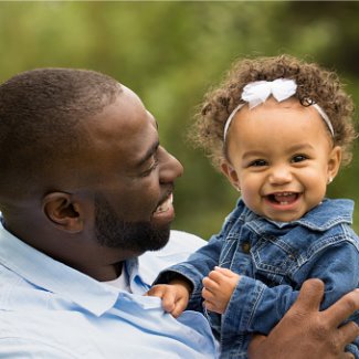 Father holding his little girl