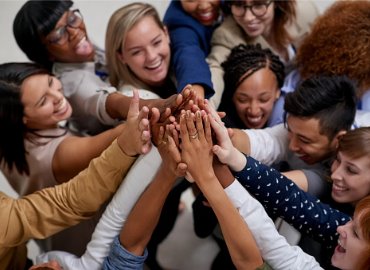 Group of happy co-workers high fiving