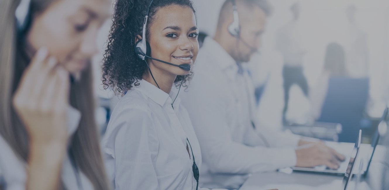 African American call center worker and teammates.