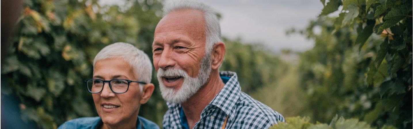 Smiling senior couple on farm